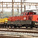 Une Ae 940 avec des wagons de ballast à Olten